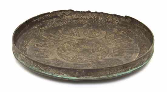 Appraisal: A Middle Eastern Hammered Metal Plate of circular form having