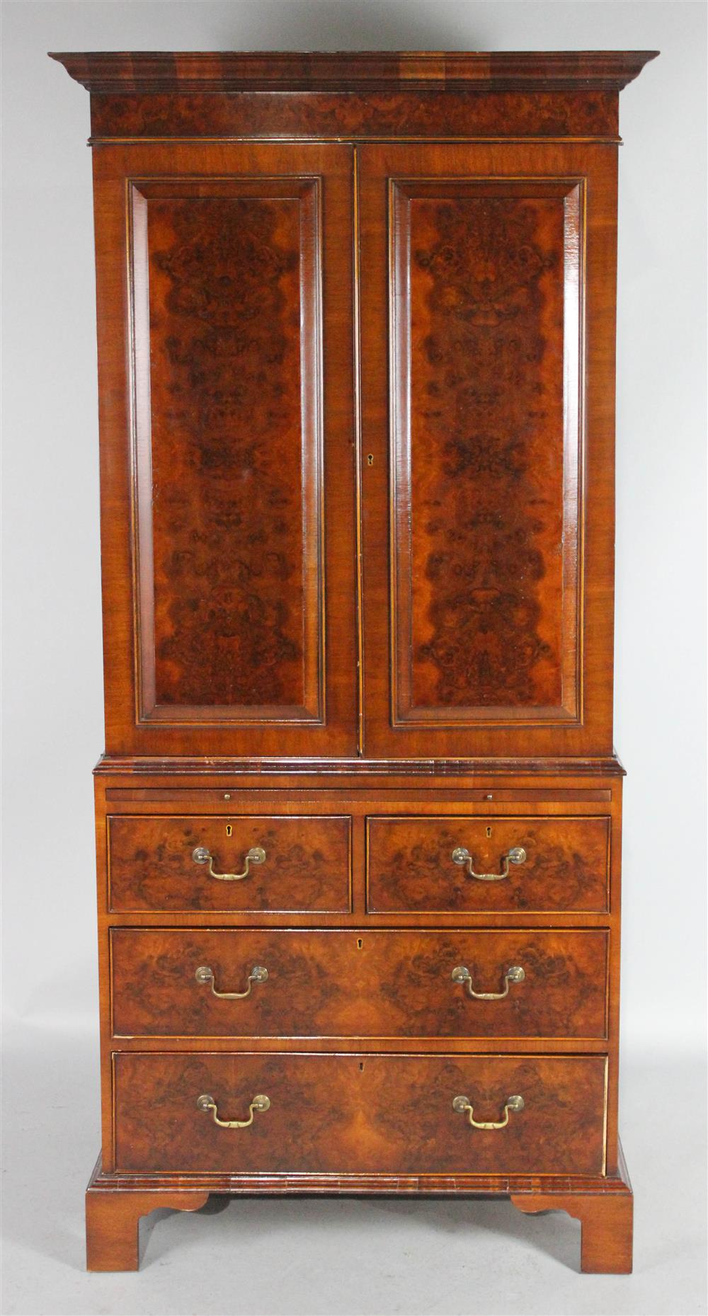 Appraisal: MILL HOUSE ANTIQUES GEORGIAN STYLE WALNUT AND MAHOGANY LINEN PRESS