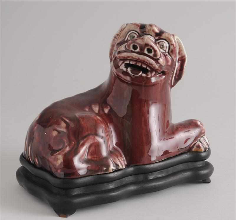 Appraisal: CHINESE FLAMB -GLAZED PORCELAIN FU DOG FIGURE ON STAND Modeled