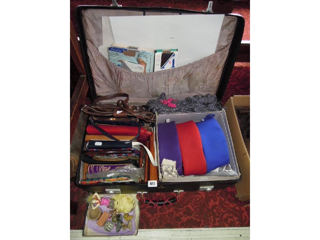 Appraisal: A suitcase containing a collection of various handbags purses three