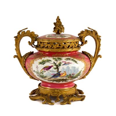 Appraisal: An ormolu-mounted Coalport pink ground pot pourri urn and cover