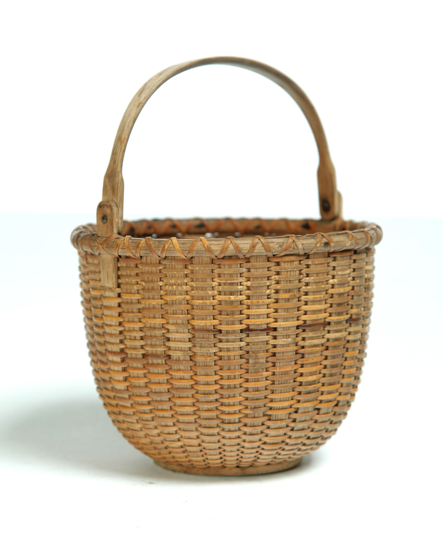 Appraisal: NANTUCKET BASKET Early th century Wooden base and bentwood swing