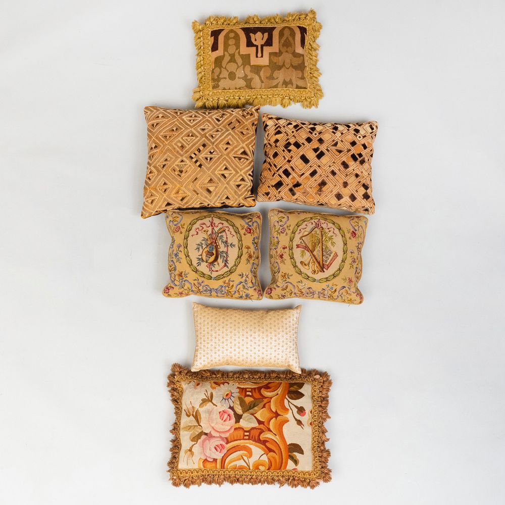 Appraisal: Group of Needlework Carpet Fragment and Barkcloth Pillows Comprising A