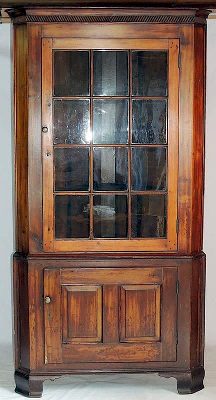 Appraisal: Pennsylvania Corner Cupboard Soft wood with -light door over a