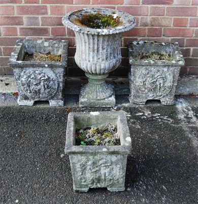 Appraisal: A reconstituted stone campana shaped urn with ribbed and fluted