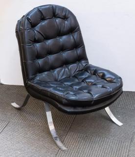 Appraisal: Vintage Mid-Century Modern tufted black leather chair in the style