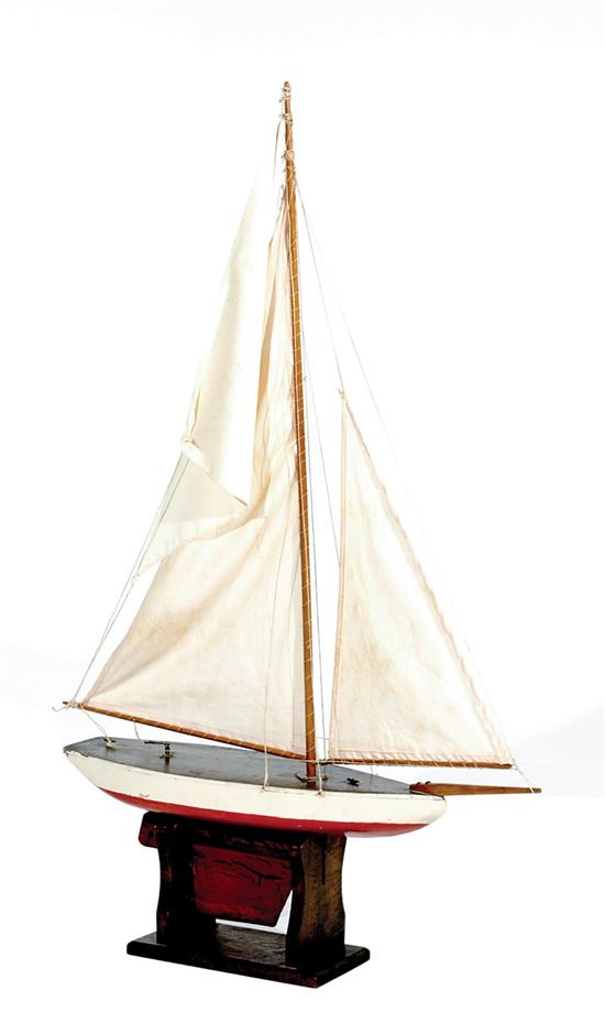 Appraisal: Carved wood pond yacht Circa Wood plank and frame hull