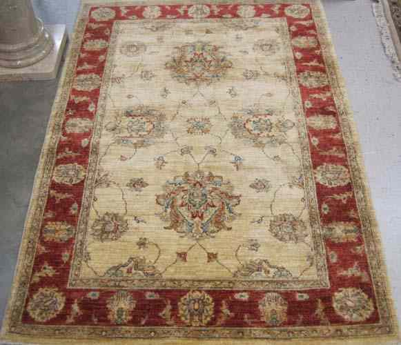 Appraisal: HAND KNOTTED ORIENTAL AREA RUG Pakistani-Persian overall floral arabesque decoration