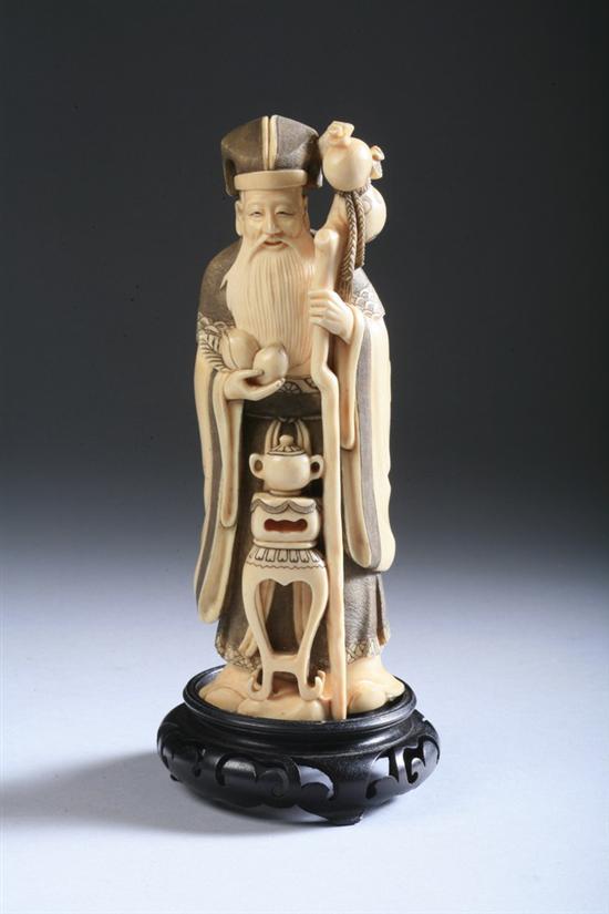 Appraisal: JAPANESE IVORY OKIMONO OF MAN Standing holding staff and double