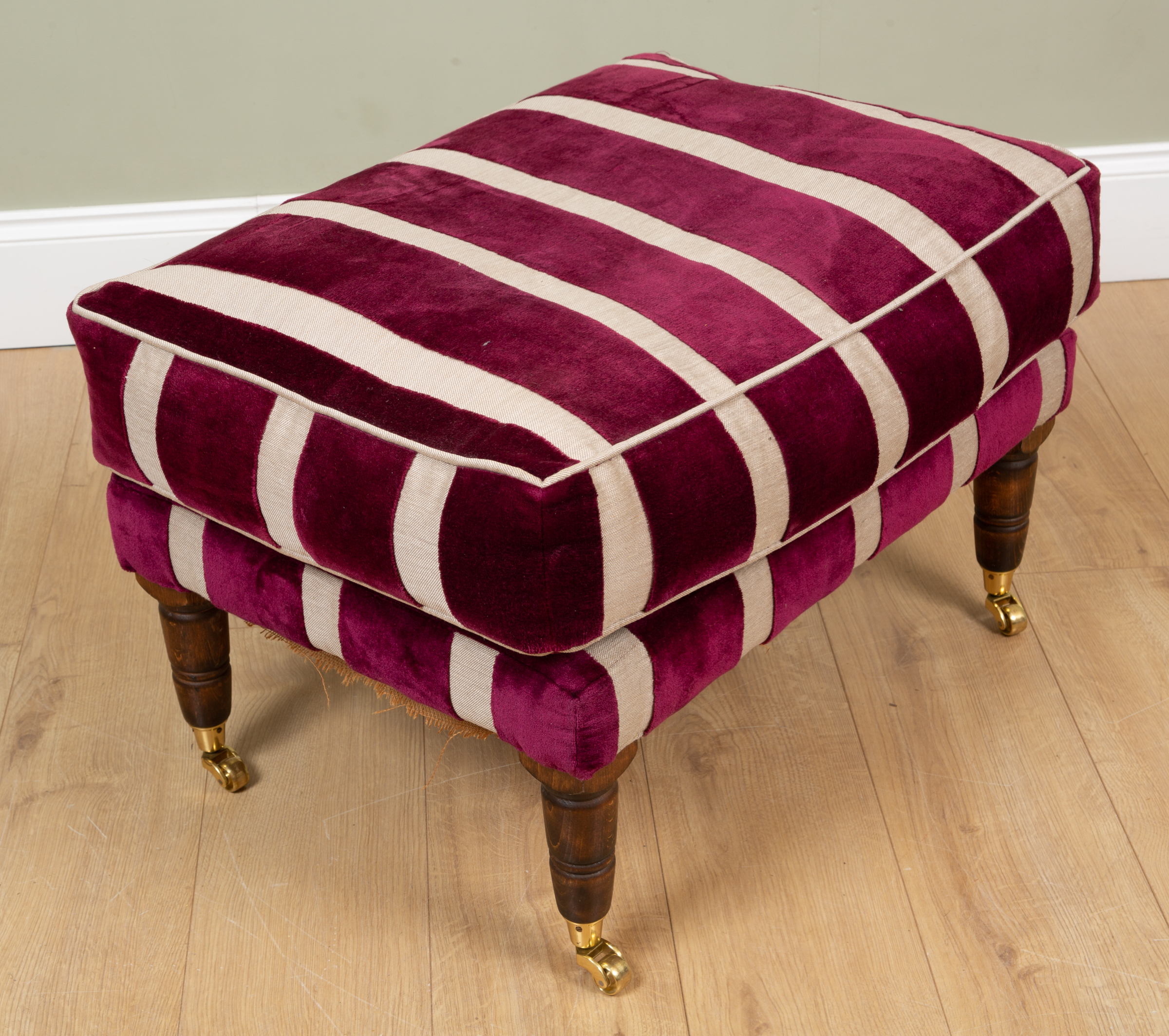 Appraisal: A purple striped upholstered rectangular stool with turned tapering dark