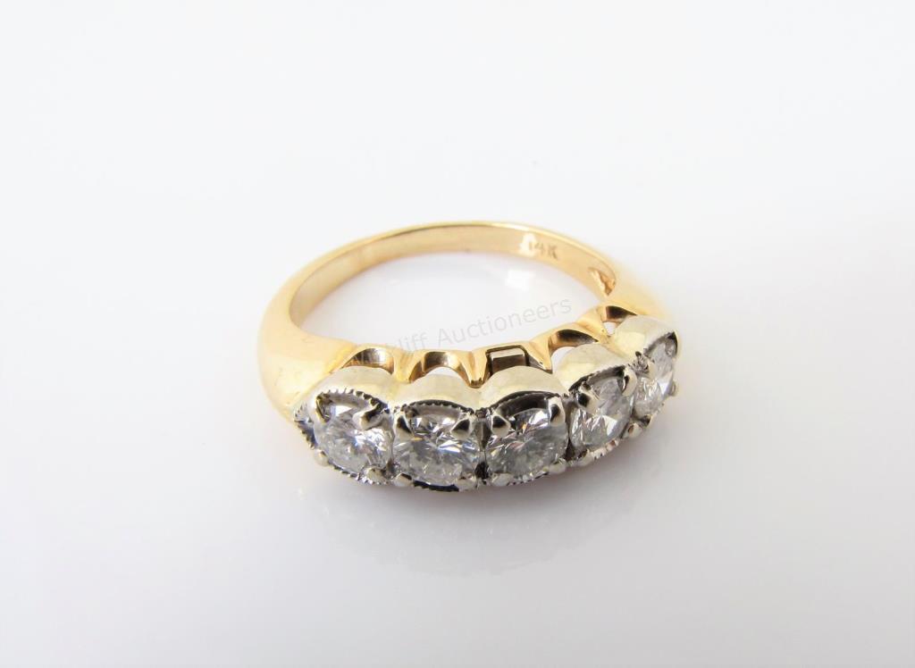 Appraisal: A K yellow and white gold five stone anniversary ring