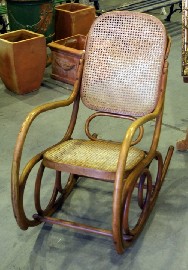 Appraisal: A bentwood and caned rocking chair by Ligna Czechoslovakia