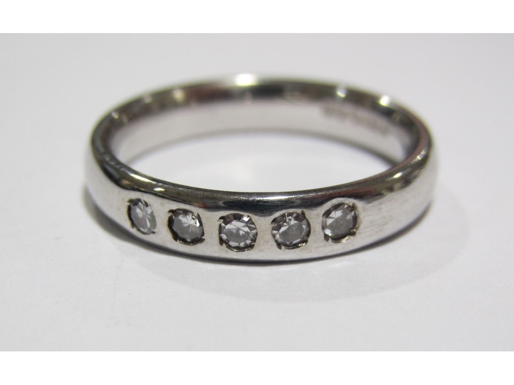 Appraisal: Eighteen carat white gold five stone diamond set band