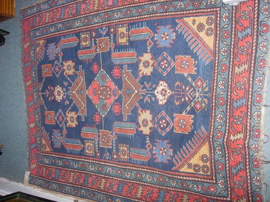 Appraisal: A HAMADAN BLUE GROUND RUG with central panel of geometric