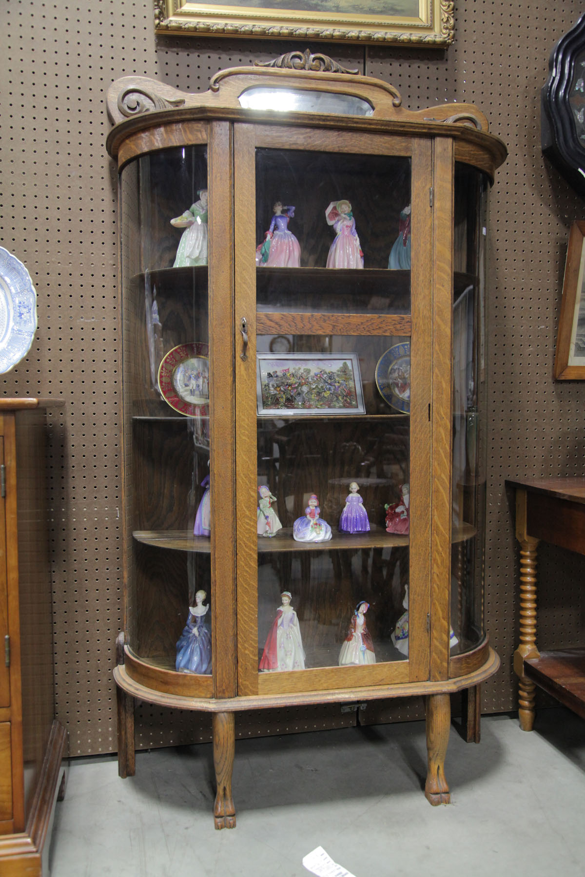 Appraisal: CHINA CABINET American early th century oak Shaped and mirrored