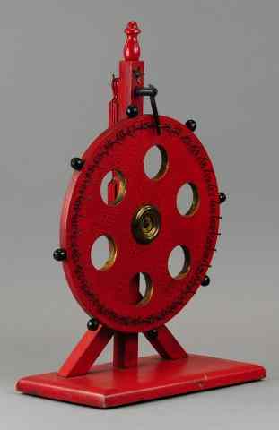 Appraisal: TABLE TOP AMUSEMENT WHEEL Early wood wheel of fortune on