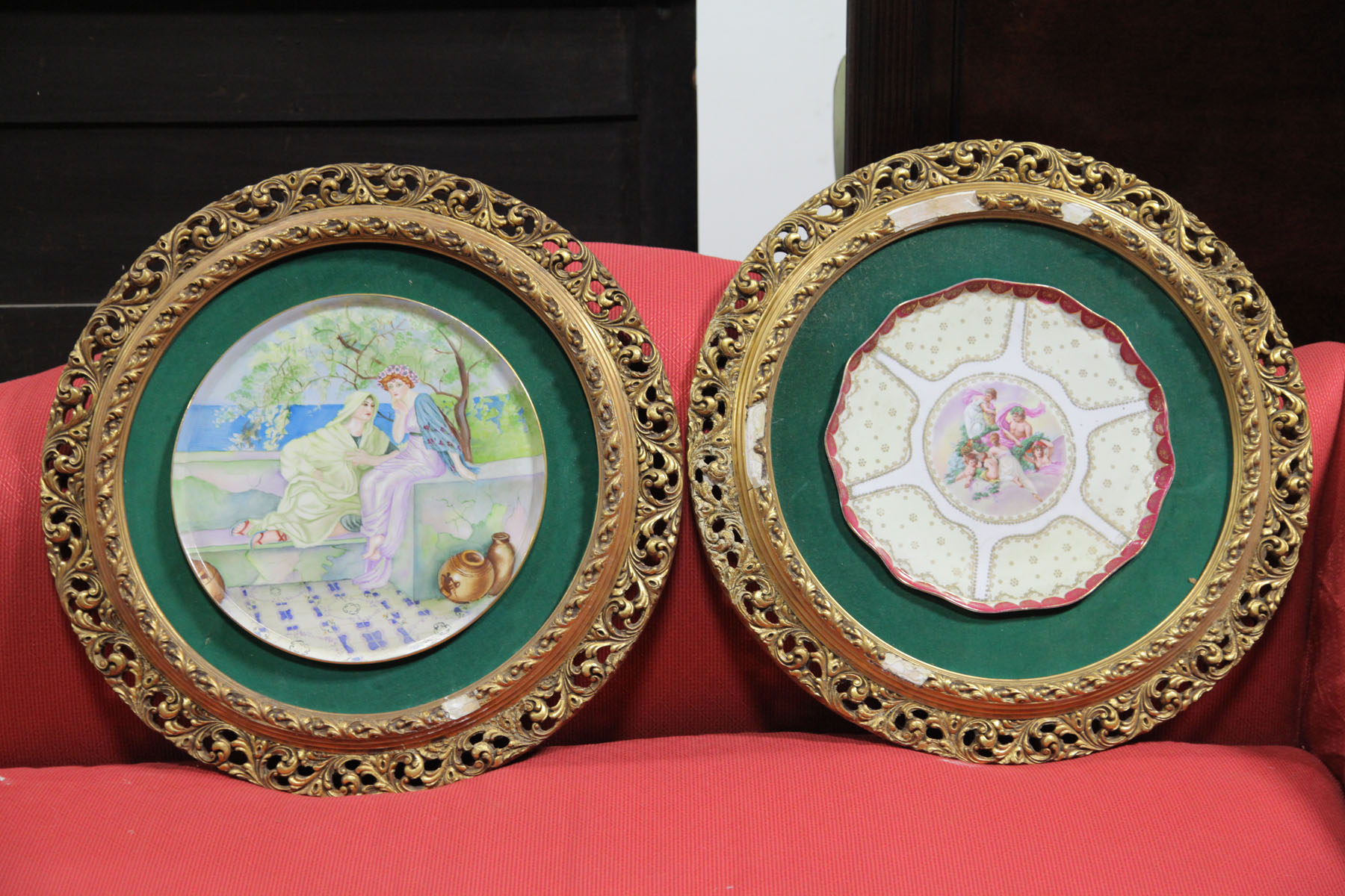 Appraisal: TWO PORCELAIN CHARGERS IN GILT FRAMES European late th early