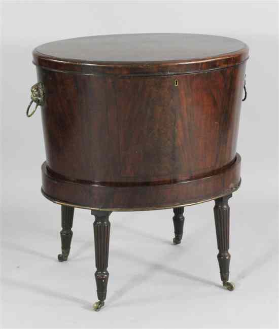 Appraisal: A George III mahogany oval cellaret on stand with zinc