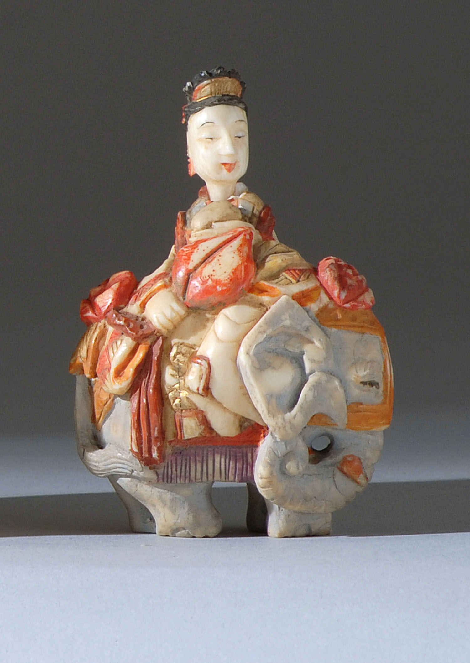 Appraisal: POLYCHROME IVORY SNUFF BOTTLE Early th CenturyIn the form of