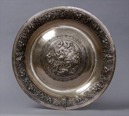 Appraisal: RENAISSANCE-STYLE SILVERED METAL CHARGER The central rondel with Bacchanalian scene