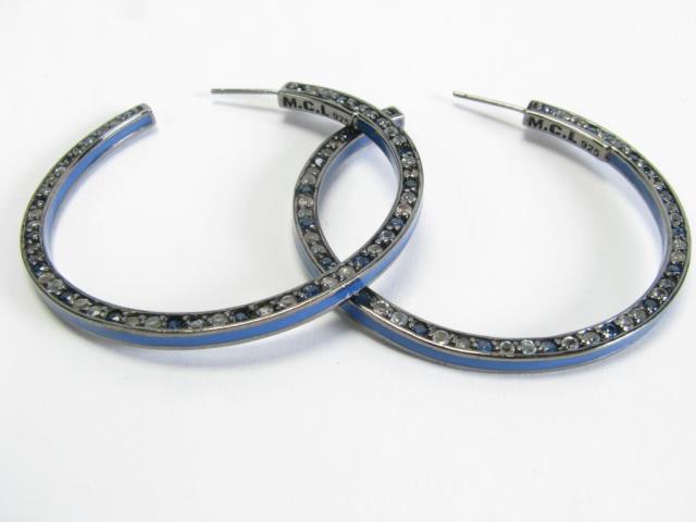 Appraisal: A pair of sterling silver blue enamel hoop earrings with