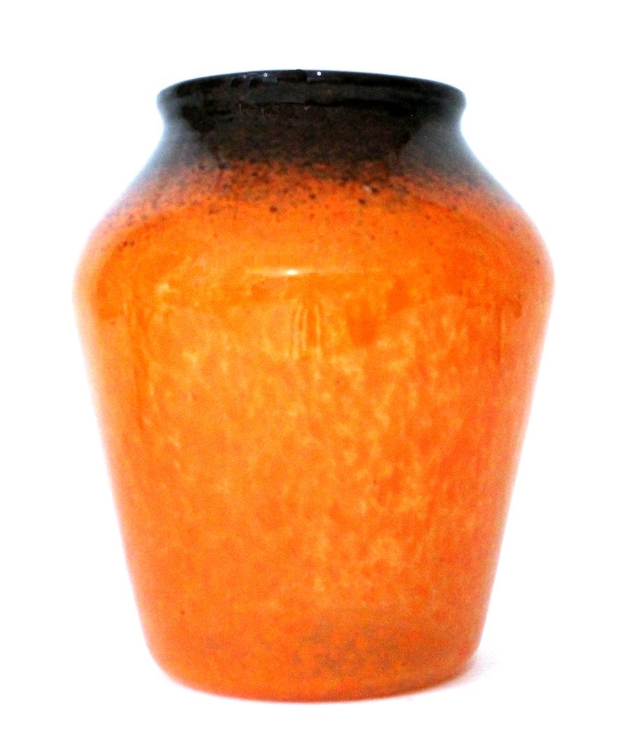 Appraisal: A Monart glass vase decorated in mottled orange tones remnants