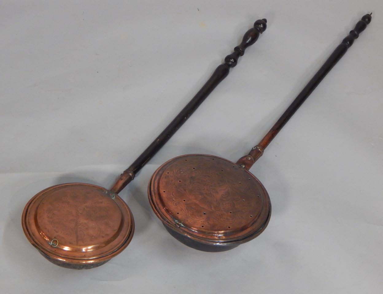 Appraisal: Two thC copper warming pans each engraved with pheasants scrolls