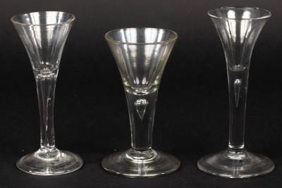 Appraisal: Three th Century wine glasses of drawn trumpet form with