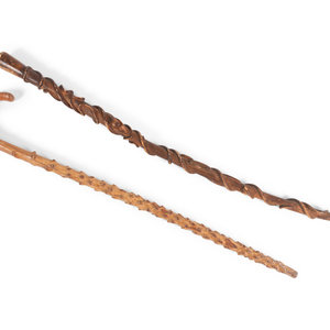 Appraisal: Two Folk Art Carved Walking Sticks comprising a maple crook