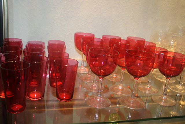 Appraisal: A SET OF TWELVE CRANBERRY WINE GLASSES and thirteen cranberry