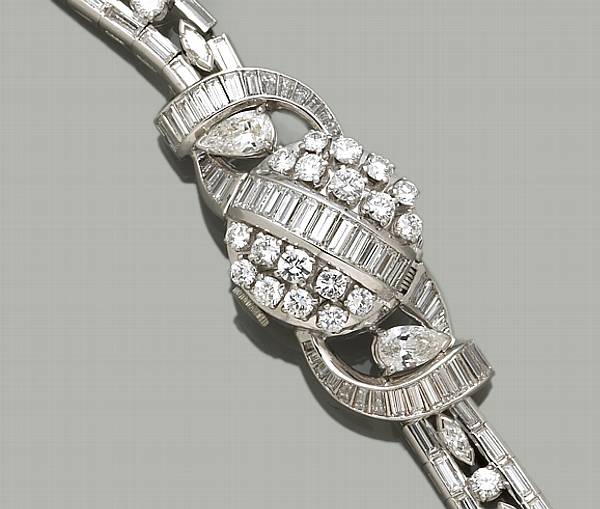 Appraisal: A lady's diamond and platinum covered wristwatch estimated total diamond