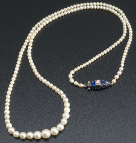 Appraisal: Strand of natural pearls with sapphire and diamond clasp in