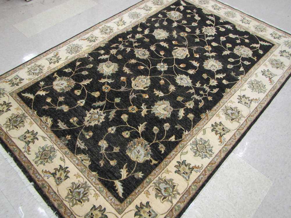 Appraisal: HAND KNOTTED ORIENTAL CARPET Pakistani Persian overall floral Isfahan design