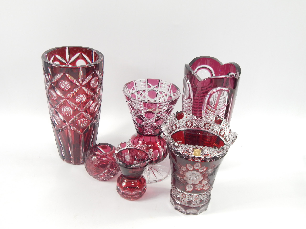 Appraisal: A group of Continental ruby glass vases including tapering vase