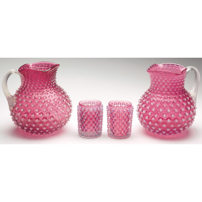 Appraisal: Hobnail water set includes a handled pitcher in cranberry glass