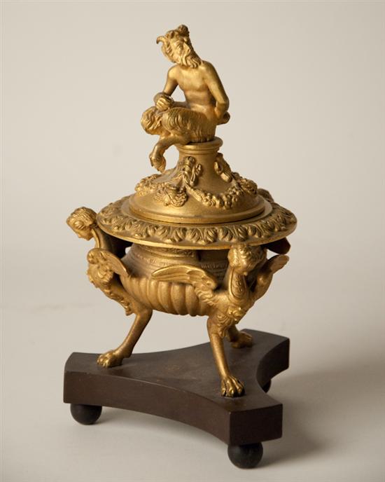 Appraisal: A th C Continental Gilt Bronze Covered Urn sculpted seated