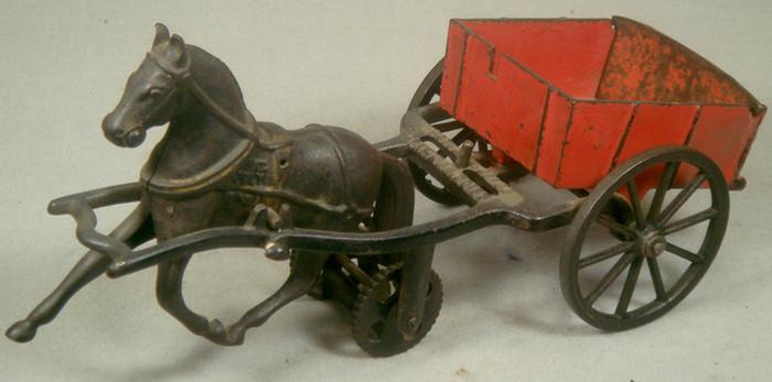 Appraisal: Cast iron toy horse drawn red cart frame stamped Pat