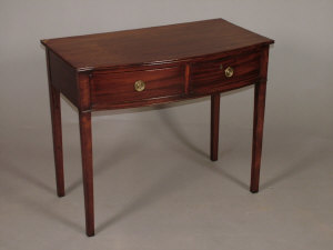 Appraisal: A mahogany bowfront two drawer side table th century upon