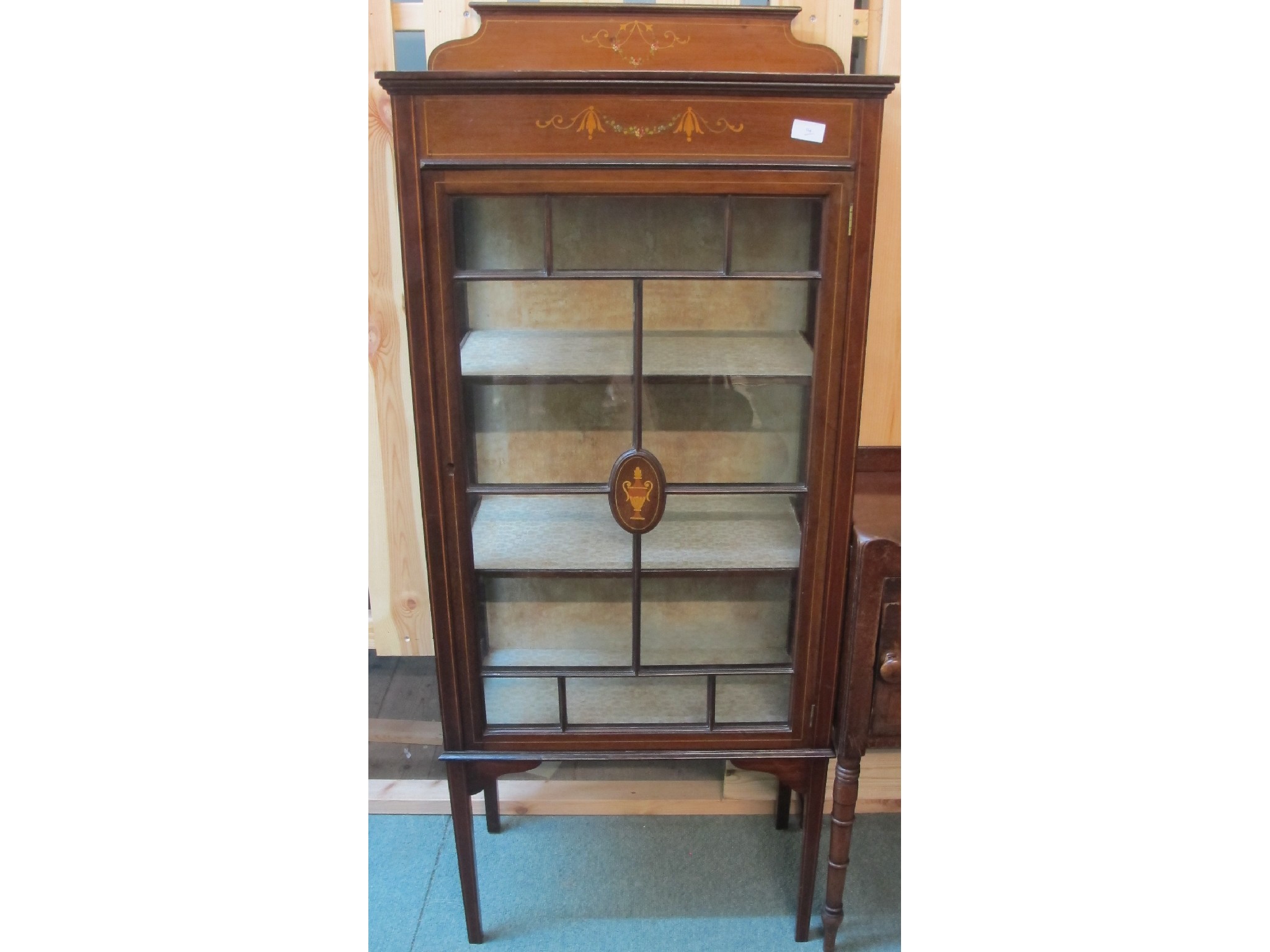 Appraisal: A small inlaid display cabinet