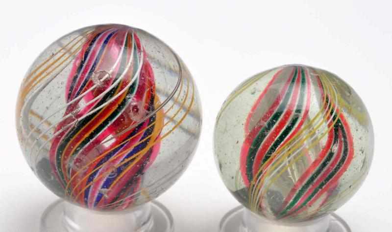 Appraisal: Lot of Divided Core Swirl Marbles Description Includes two multicolored