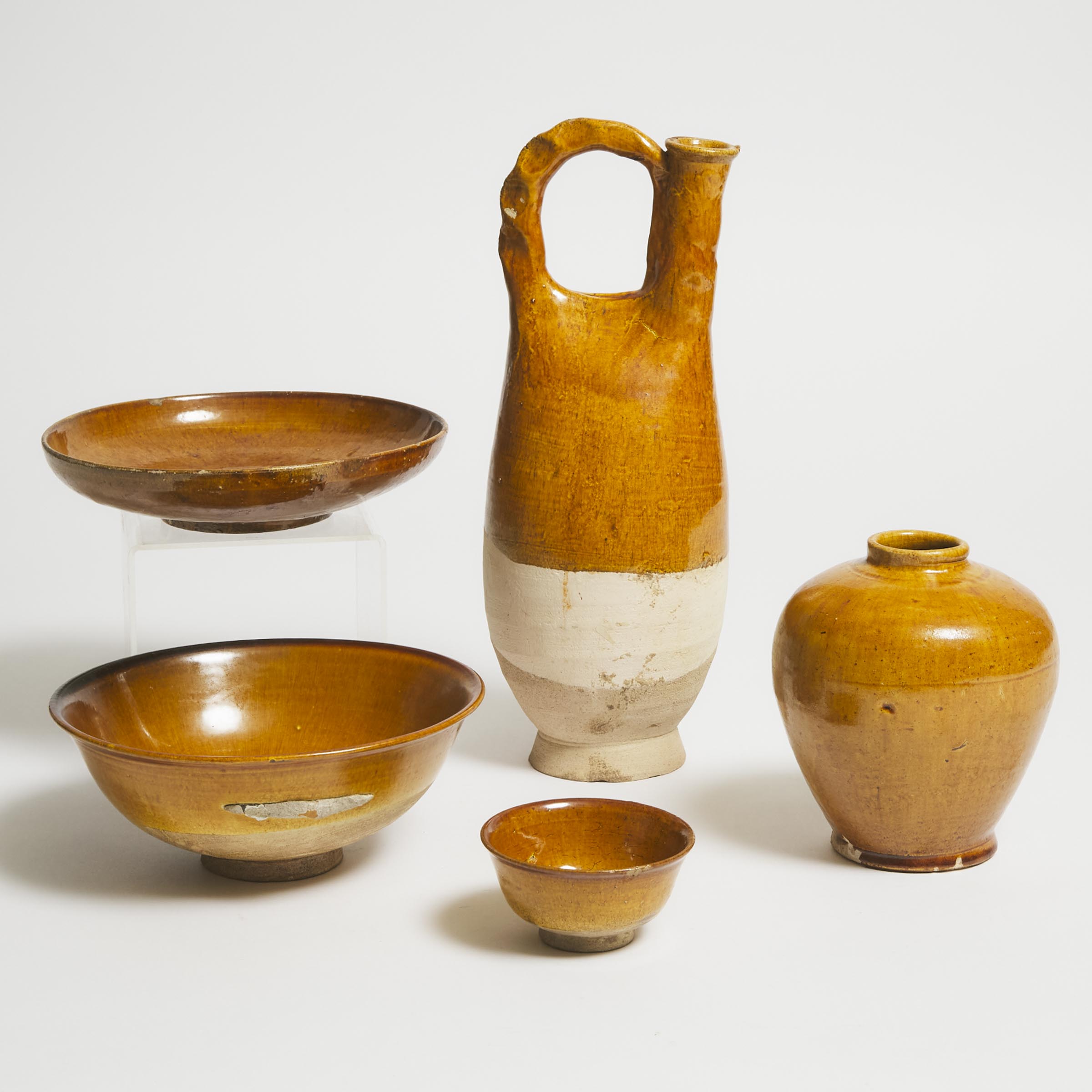 Appraisal: A Group of Five Amber-Glazed Wares Tang-Liao Dynasty AD -