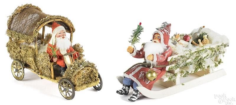 Appraisal: Painted composition Santa in a moss and loofah car Painted