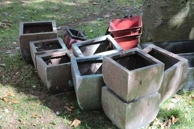 Appraisal: A GROUP OF FIVE SQUARE COPPER PLANTERS together with a