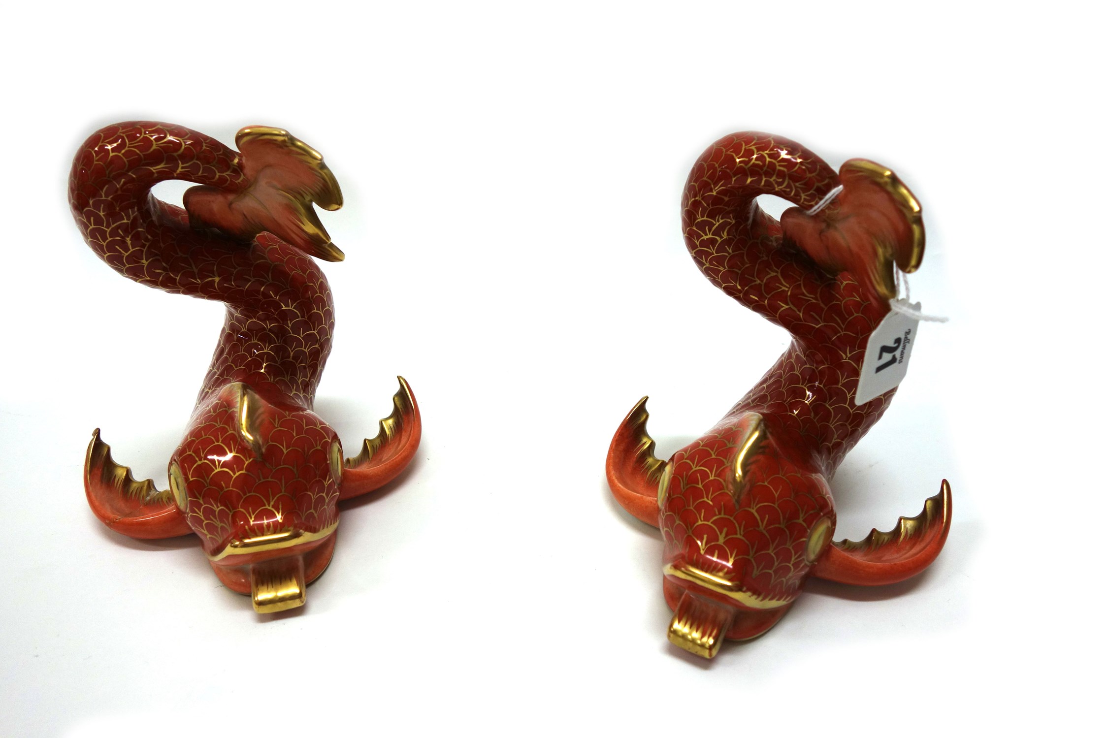 Appraisal: A pair of Herend porcelain figures of dolphins cm high