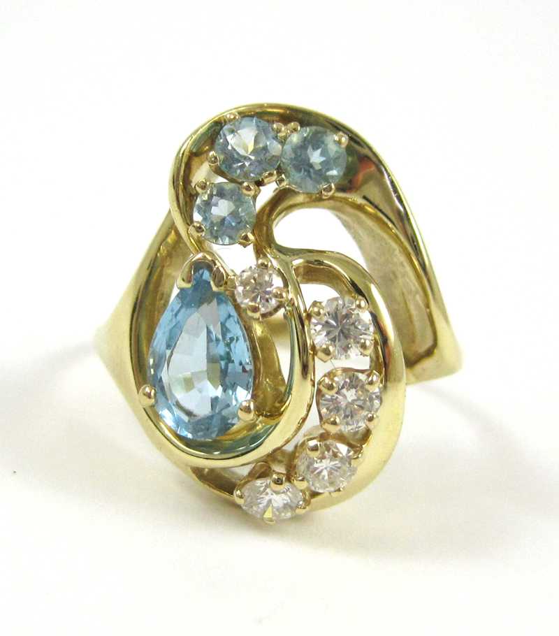 Appraisal: AQUAMARINE DIAMOND AND FOURTEEN KARAT GOLD RING set with five