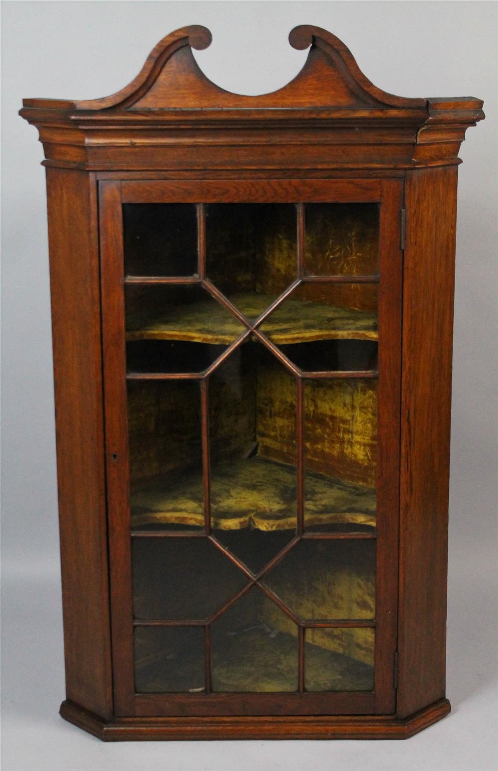 Appraisal: GEORGE III STYLE OAK HANGING CORNER CUPBOARD having a swan