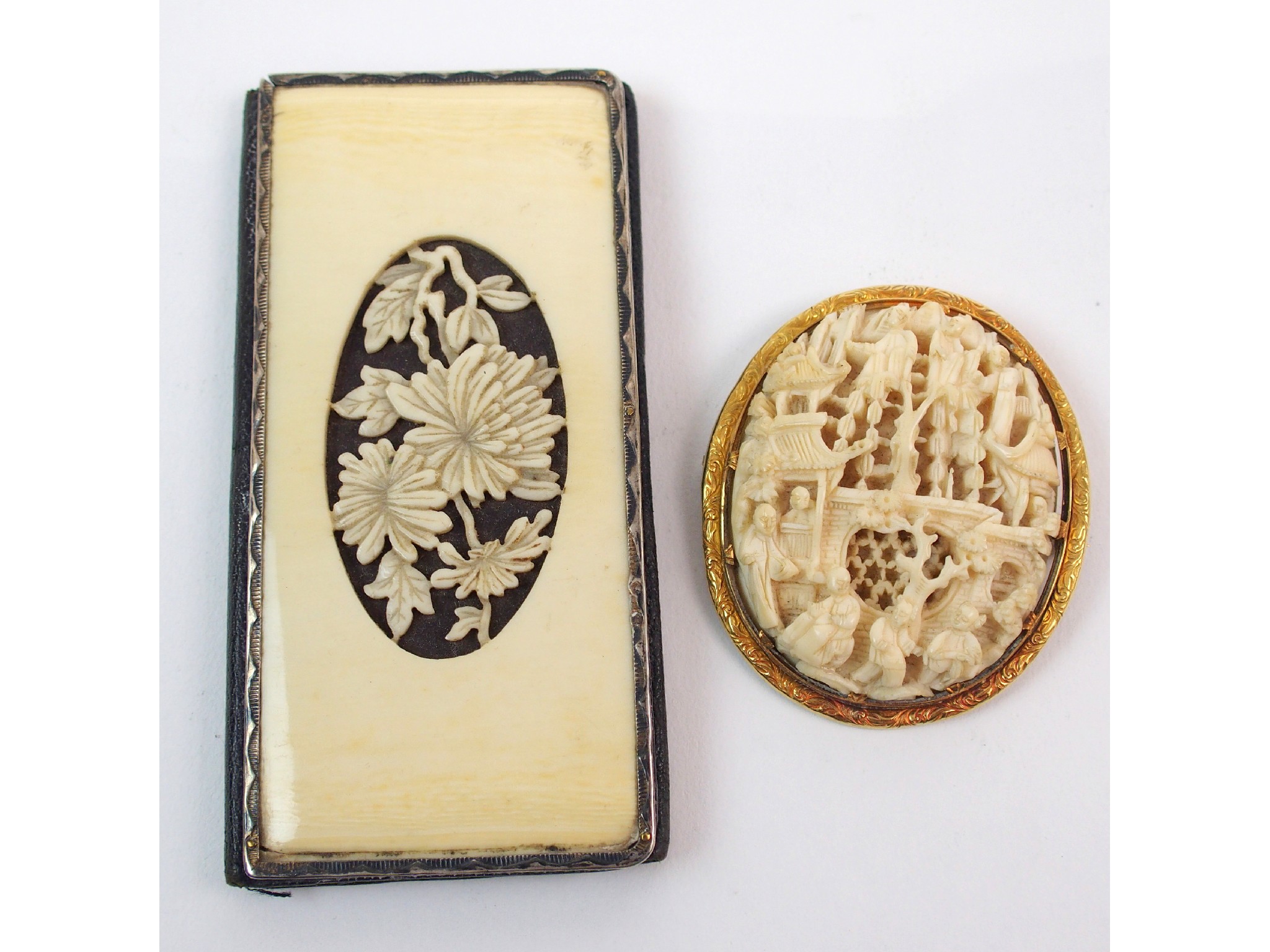 Appraisal: A Cantonese carved ivory oval medallion broochdecorated with figures amongst