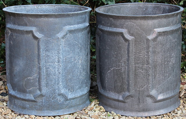 Appraisal: A PAIR OF GEORGIAN STYLE CYLINDRICAL LEAD GARDEN PLANTERS with