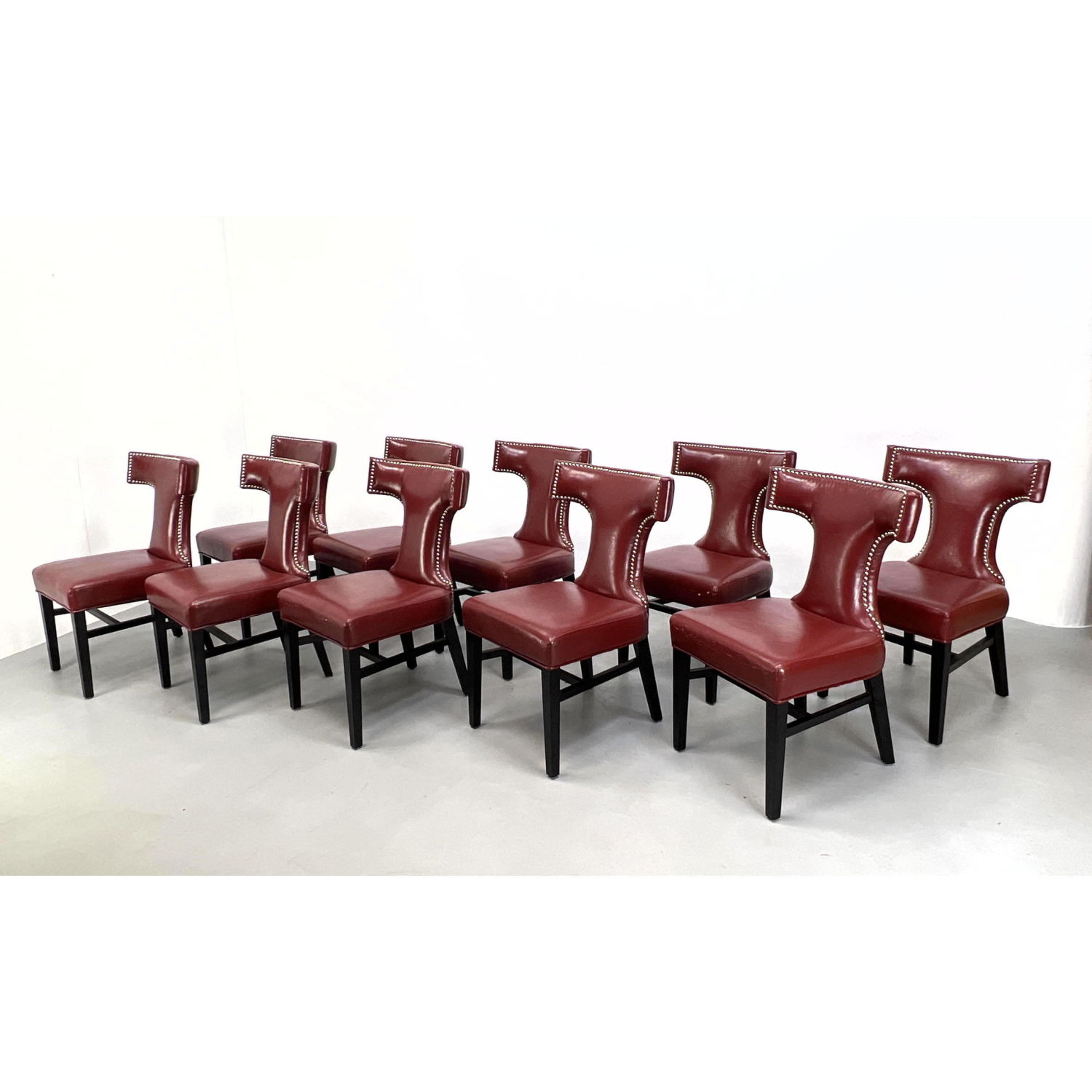 Appraisal: Set of Wine Vinyl Upholstered Dining Chairs Bowed T form