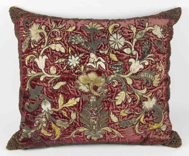 Appraisal: An embroidered cushion covered with th Century Spanish red velvet